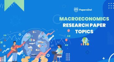 Students analyzing macroeconomics research topics with graphs and financial symbols.