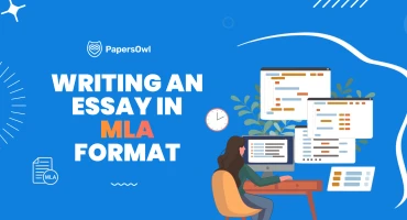 A person working on a laptop following MLA style rules for academic paper formatting and citations.